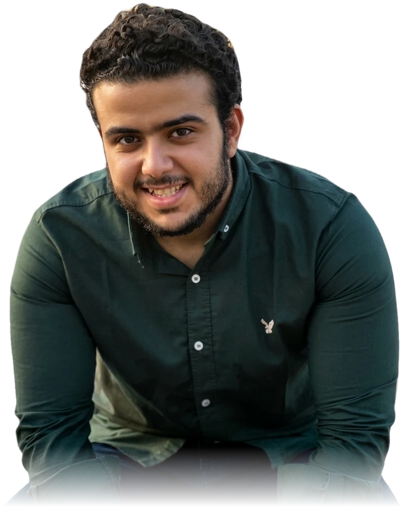 Marwan Maher, smiling, in a dark green shirt